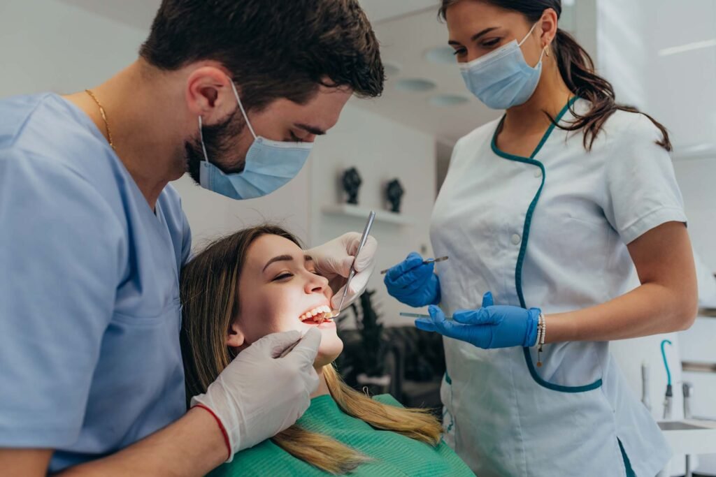 woman patient in dental clinic being examined by a TUR3YJD