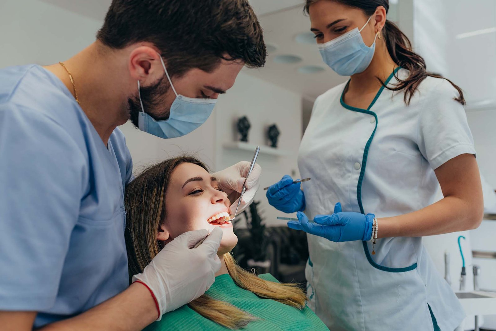 woman patient in dental clinic being examined by a TUR3YJD