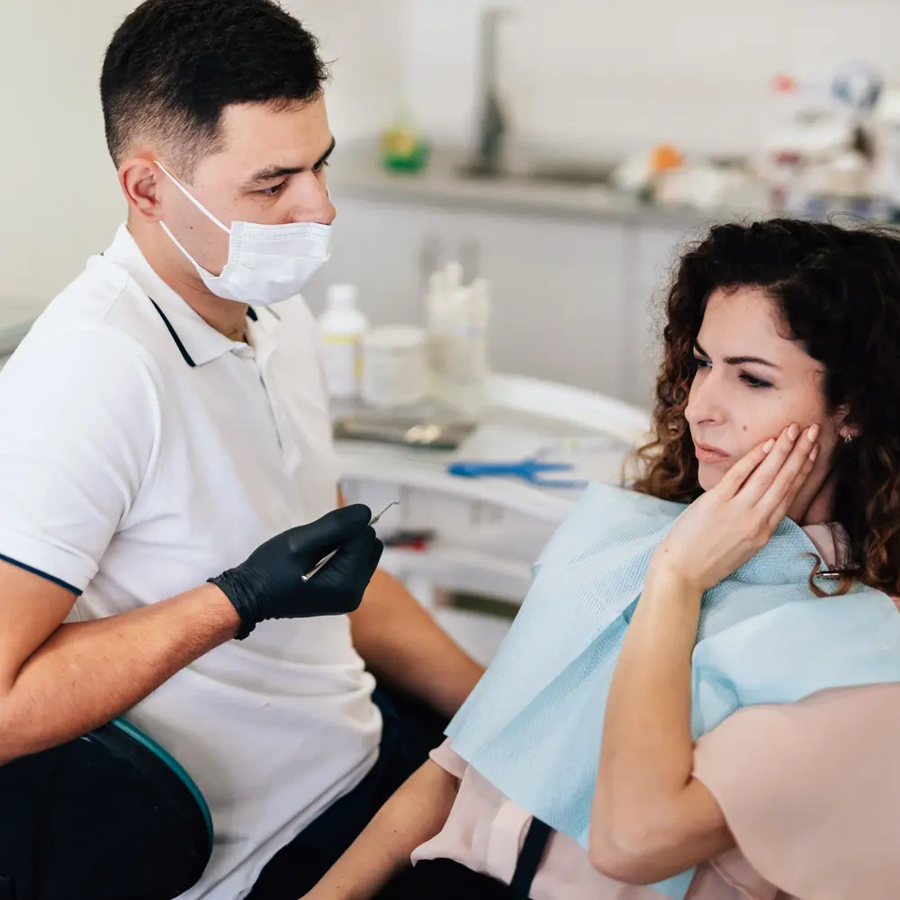 woman with toothache dentist ezgif.com optiwebp
