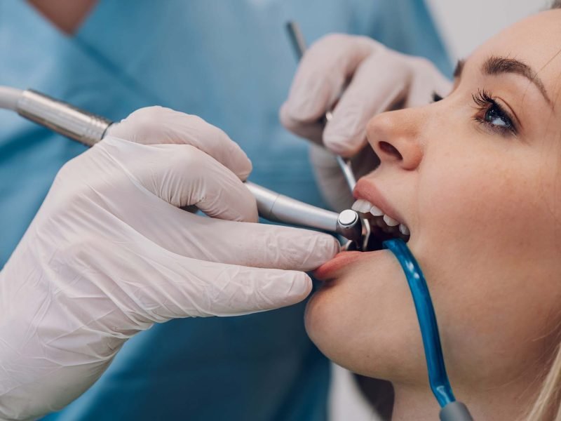 woman-patient-in-dental-clinic-being-examined-by-a-GHQ4RFY.jpg